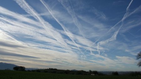 An image of chemtrails left in the air by aeroplanes 814778691