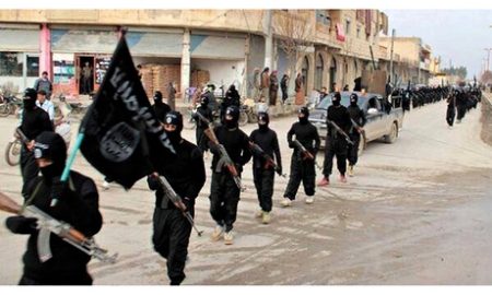 Isis fighters parade through raqqa