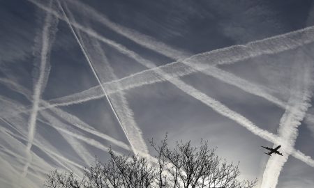 Chemtrail sky with jet